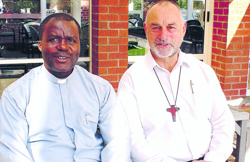 Fr John Vianney Makanda and St Mary's parish priest Fr Peter Murphy.
