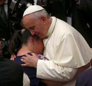 Pope embraces woman