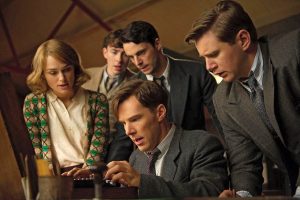 A scene from The Imitation Game starring Benedict Cumberbatch (seated) as Alan Turing, who helped cracked the Enigma code during World War II. 