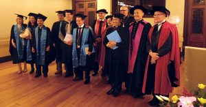 Those who received degrees and graduate diplomas in theology with staff and visitors after the Good Shepherd College graduation ceremony.