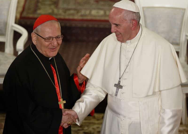 Pope Francis greets Cardinal Louis Sako, the Baghdad-based patriarch of the Chaldean Catholic Church, during a meeting with Chaldean Catholics at the Church of St. Simon the Tanner in Tbilisi, Georgia, Sept. 30, 2016. Pope Francis plans to visit Iraq March 5-8, 2021. (CNS photo/Paul Haring)
