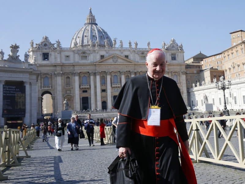 Cardinal Marc Ouellet, prefect of the Congregation for Bishops, walks through St. Peter's Square at the Vatican in this Feb. 21, 2019, file photo. Cardinal Ouellet announced plans for a major international conference at the Vatican in 2022 on the theology of the priesthood. (CNS photo/Paul Haring)