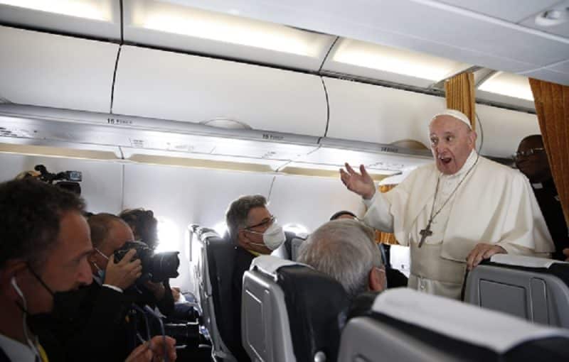 Pope Francis answers questions from journalists aboard his flight from Bratislava, Slovakia, to Rome Sept. 15, 2021. (CNS photo/Paul Haring)
