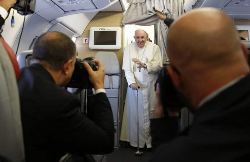 Pope Francis arrives to answer questions from journalists aboard his flight from Nur-Sultan, Kazakhstan, to Rome Sept. 15, 2022. (CNS photo/Paul Haring)