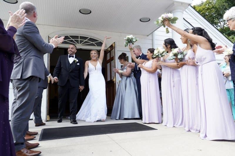 Julio Prendergast and Christina MacDougall are all smiles as they exit St. John the Baptist Church in Wading River, N.Y., following their wedding Mass Aug. 20, 2021. (CNS file/OSV News photo, Gregory A. Shemitz) See MARRIAGE-CATECHUMENATE-ACCOMPANIMENT