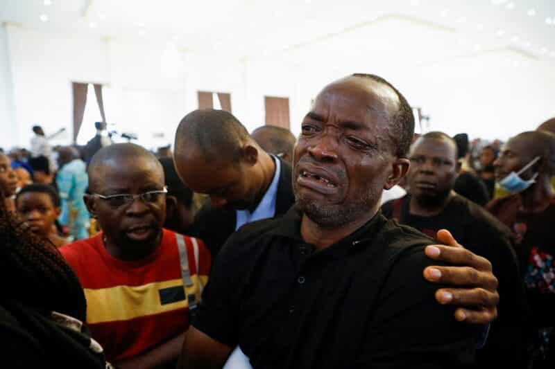A man cries during a funeral Mass in the the parish hall of St. Francis Xavier Church in Owo, Nigeria, June 17, 2022. The Mass was for some of the 40 victims killed in a June 5 attack by gunmen during Mass at the church. 52,250 people have been killed over the last 14 years in Nigeria only for being Christians, a new report published April 10 revealed (OSV News photo/Temilade Adelaja, Reuters)