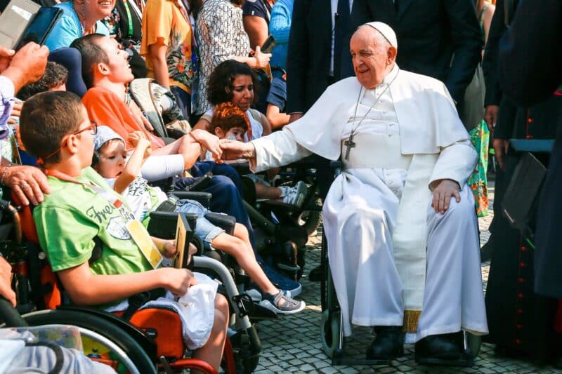 Pope Francis greets children with a variety of illnesses and physical challenges after reciting the rosary at the Chapel of Apparitions at the Shrine of Our Lady of Fátima in Fátima, Portugal, Aug. 5, 2023. (CNS photo/Lola Gomez)