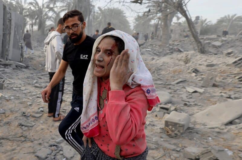 An injured Palestinian woman gestures after an Israeli airstrike on a house in Khan Younis, in the southern Gaza Strip, Nov. 22, 2023, amid the ongoing conflict between Israel and the Palestinian Islamist group Hamas. (OSV News photo/Mohammed Salem, Reuters)